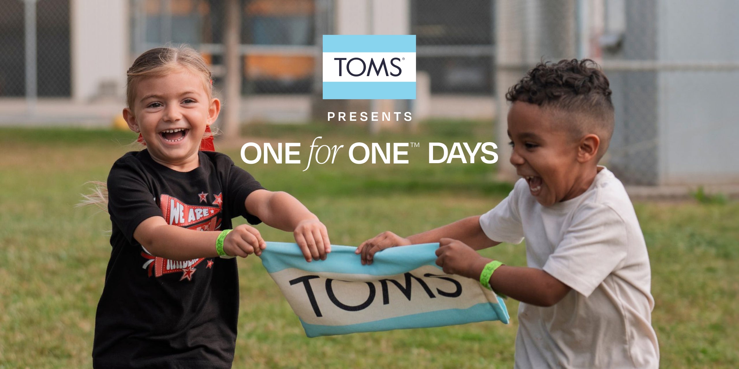 Kids are holding TOMS flag bag