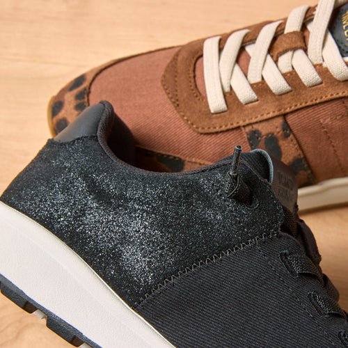 Detail shot of the black metallic TRVL Lite Cabrillo sneaker