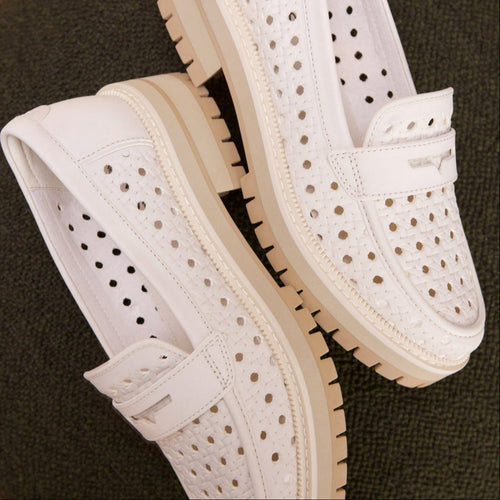 Laydown image of the perforated light sand leather embossed Cara loafers