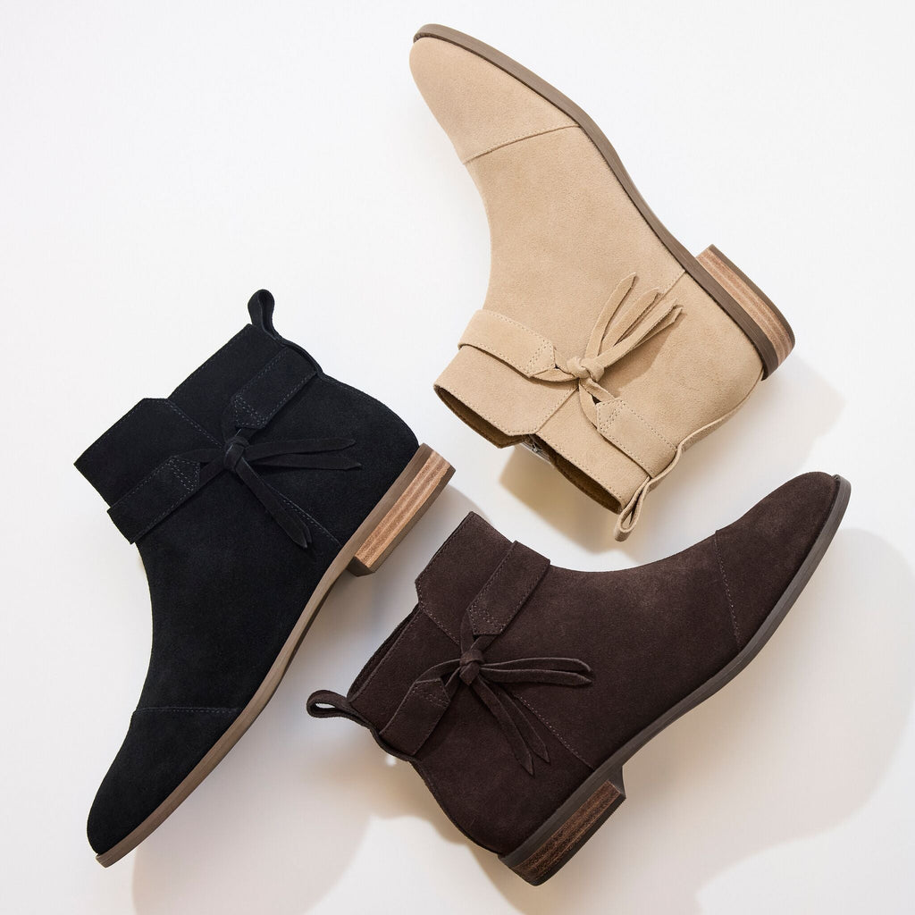 Laydown image of the Womens Stacey Ankle Bootie in Taupe, Brown and Black Suede