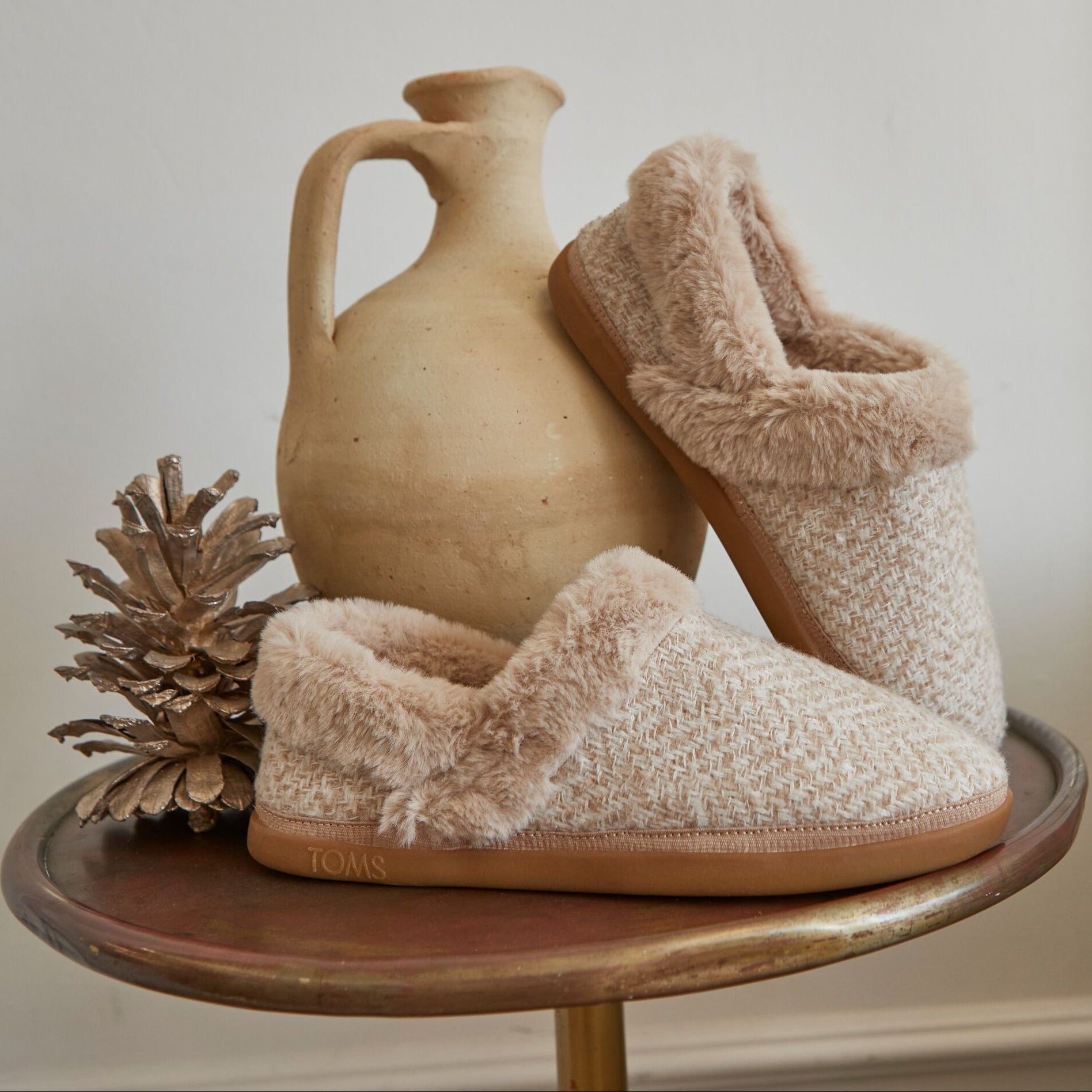 Laydown image of the oatmeal oslo slippers